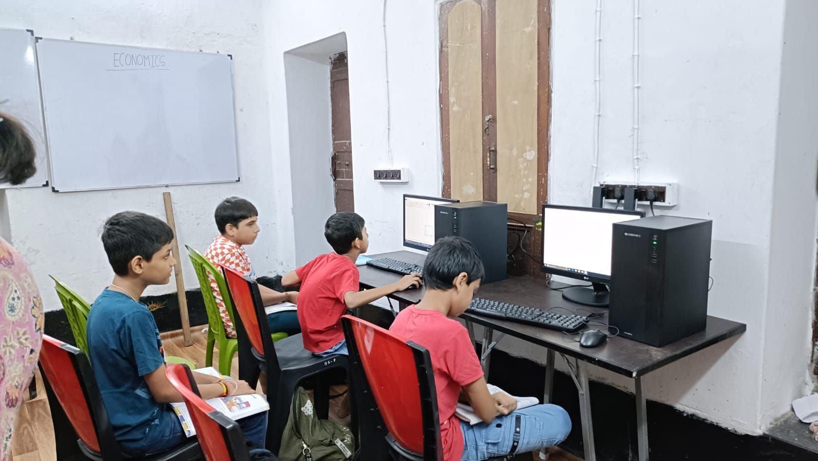 Students attending an in-person tuition class at Rhythm's Tutorial