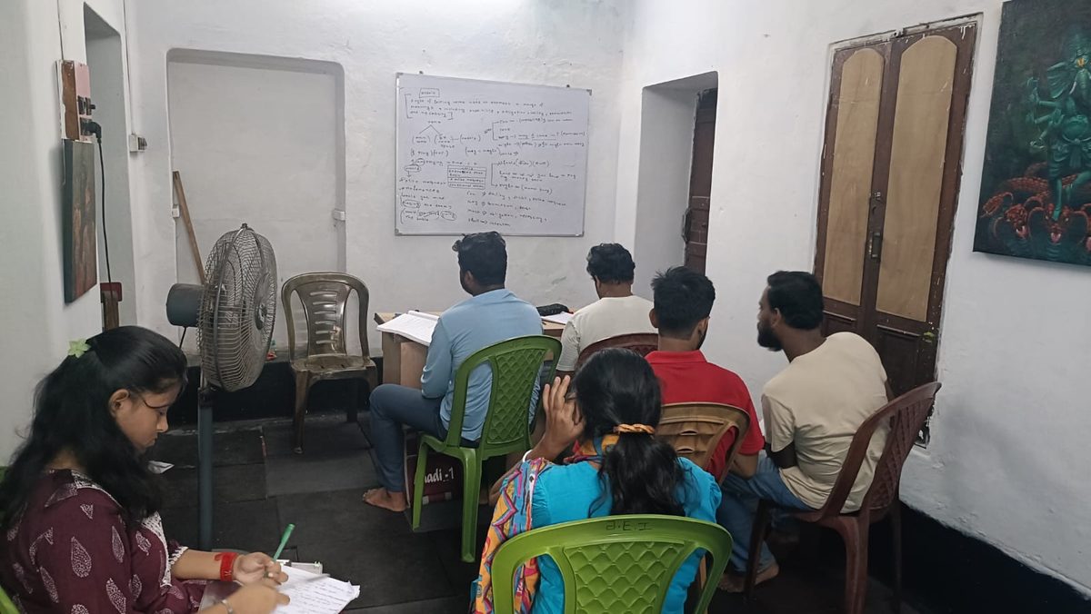 Students attending a full in-person batch at Rhythm's Tutorial, taking notes